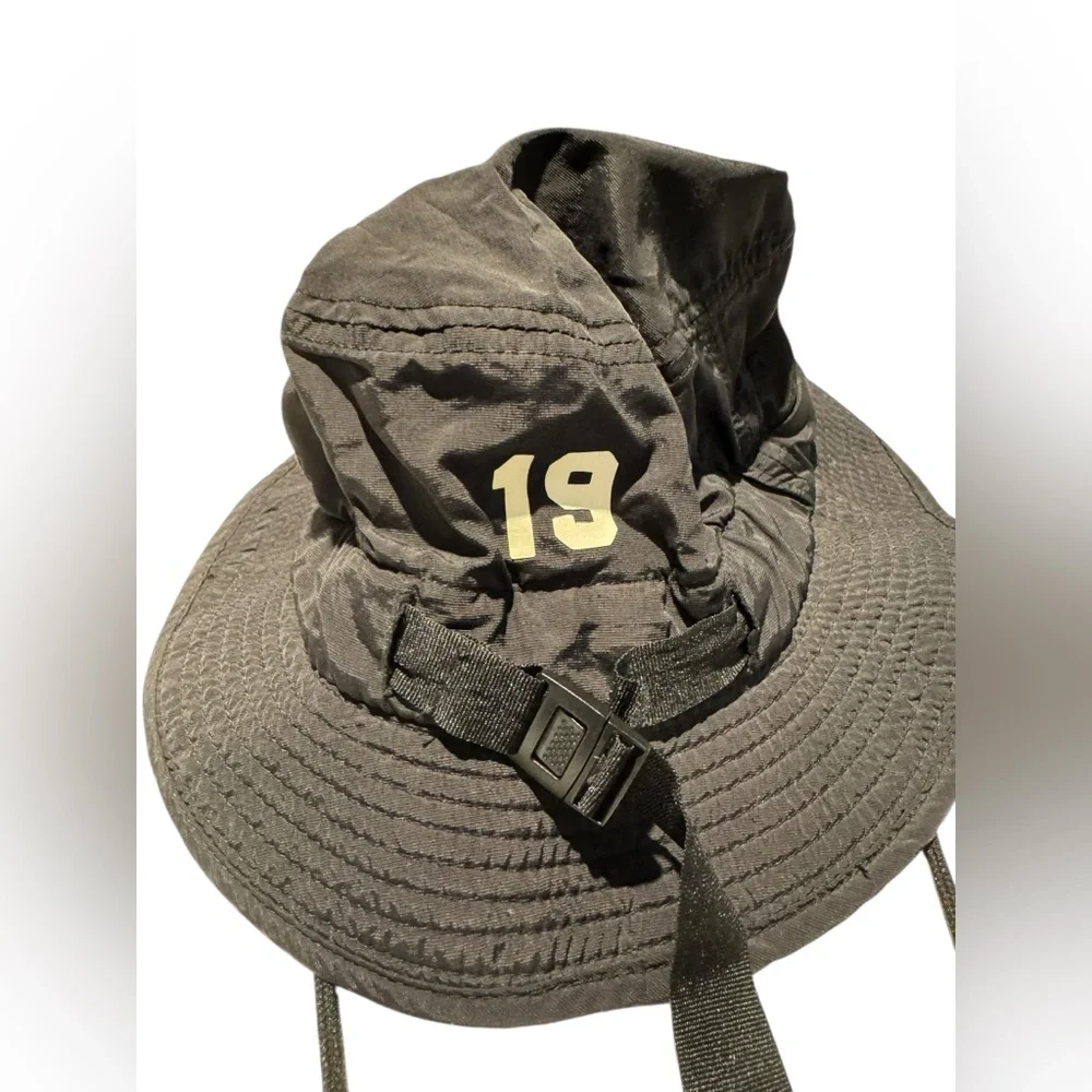 Black Bucket Hat with Purple New Rochelle Lacrosse branding. Gently worn